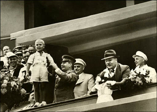 И.Сталин и В.Молотов принимают цветы от детей. Стадион "Динамо" в Москве во время физкультурного парада